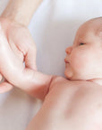 Mum bonding with baby using Pod Organics massage oil in bedtime routine