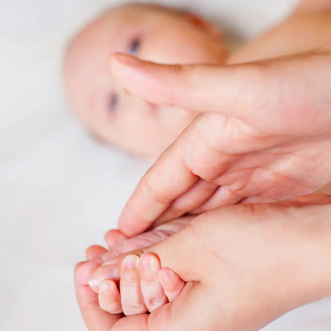Close-up of a baby&#39;s foot being massages