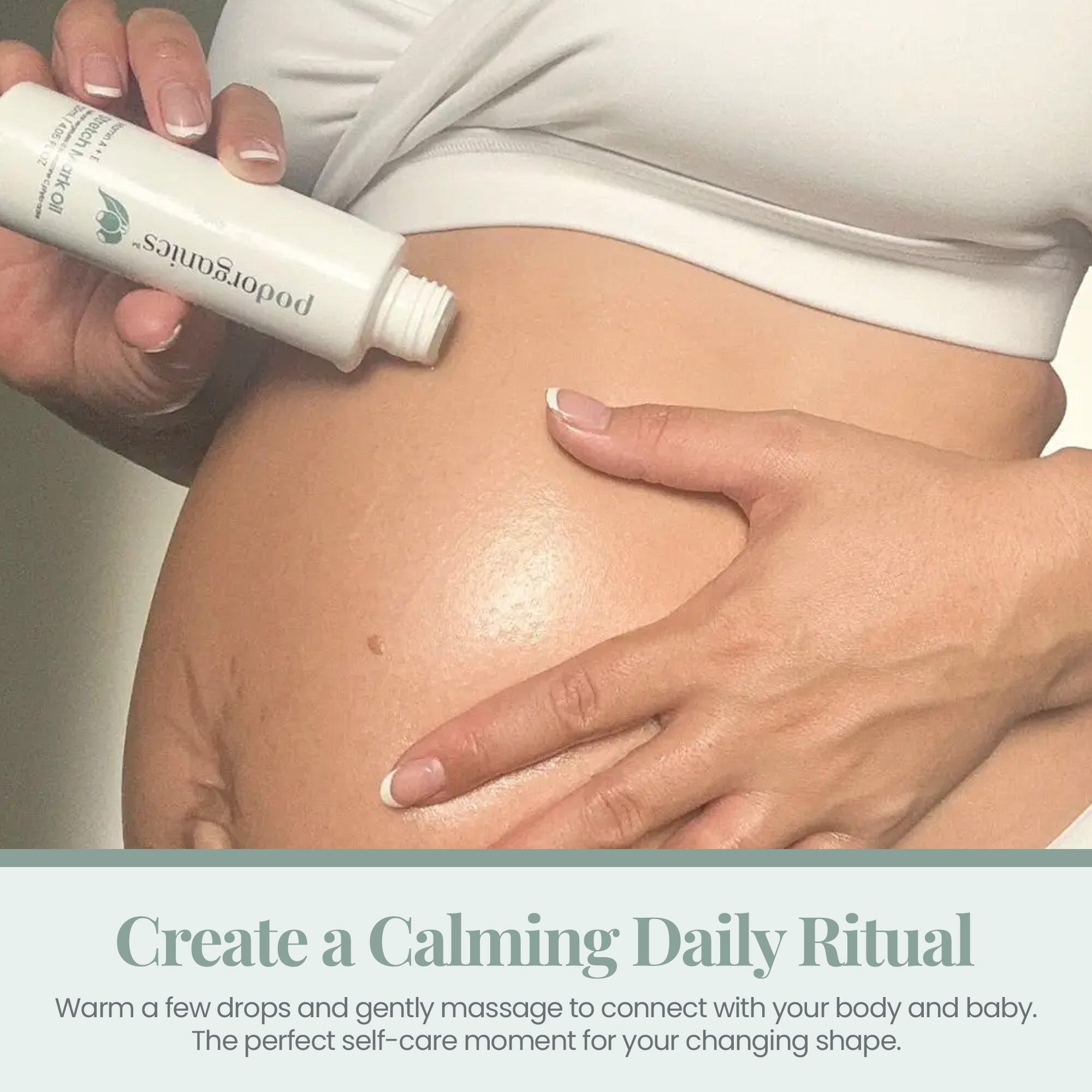 A pregnant belly being massaged with Pod Organics Nipple Cream &amp; Belly Butter